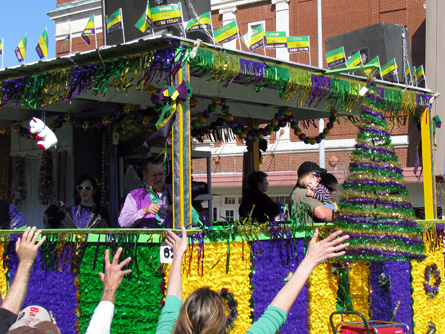 Float A festive float in Mardi Gras colors.